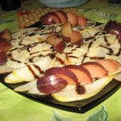 Carpaccio di pere forelle dure con scaglie di grana, susine e balsamico