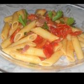 Penne risottate con pomodorini, speck e brandy