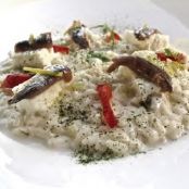 Risotto con bianco di pomodoro, bufala campana, alici di Cetara, alghe e limone candito